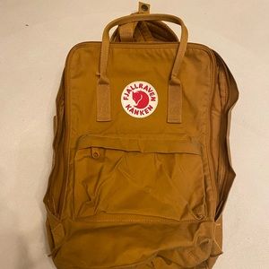 large yellow Fjäll Räven book bag
